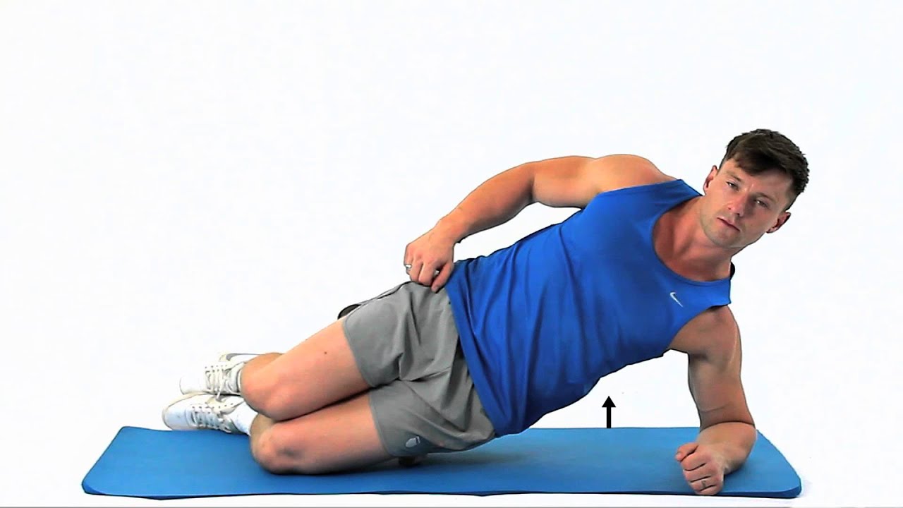A beginner holding a knee-down side plank on a mat, forearm planted under the shoulder, hips lifted, and a straight line from head to knees