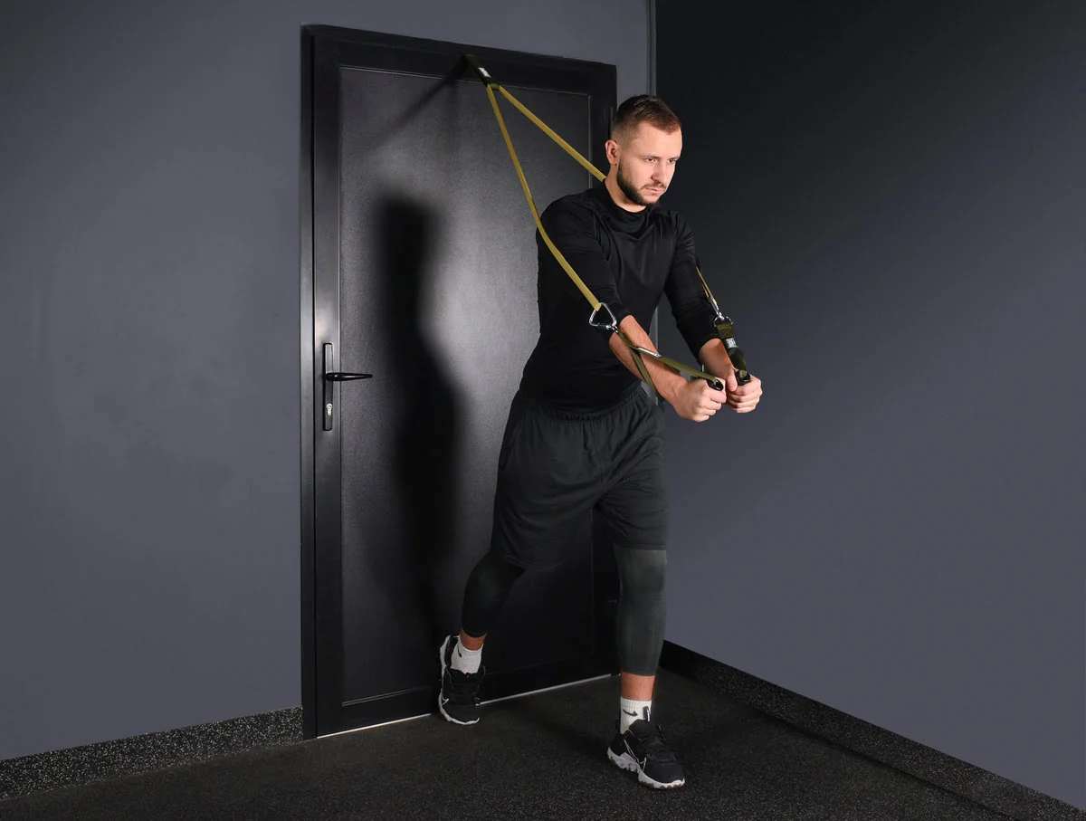 A door anchor strap placed so the door would be pushed into the frame during the pull, with the band running straight and the door fully latched