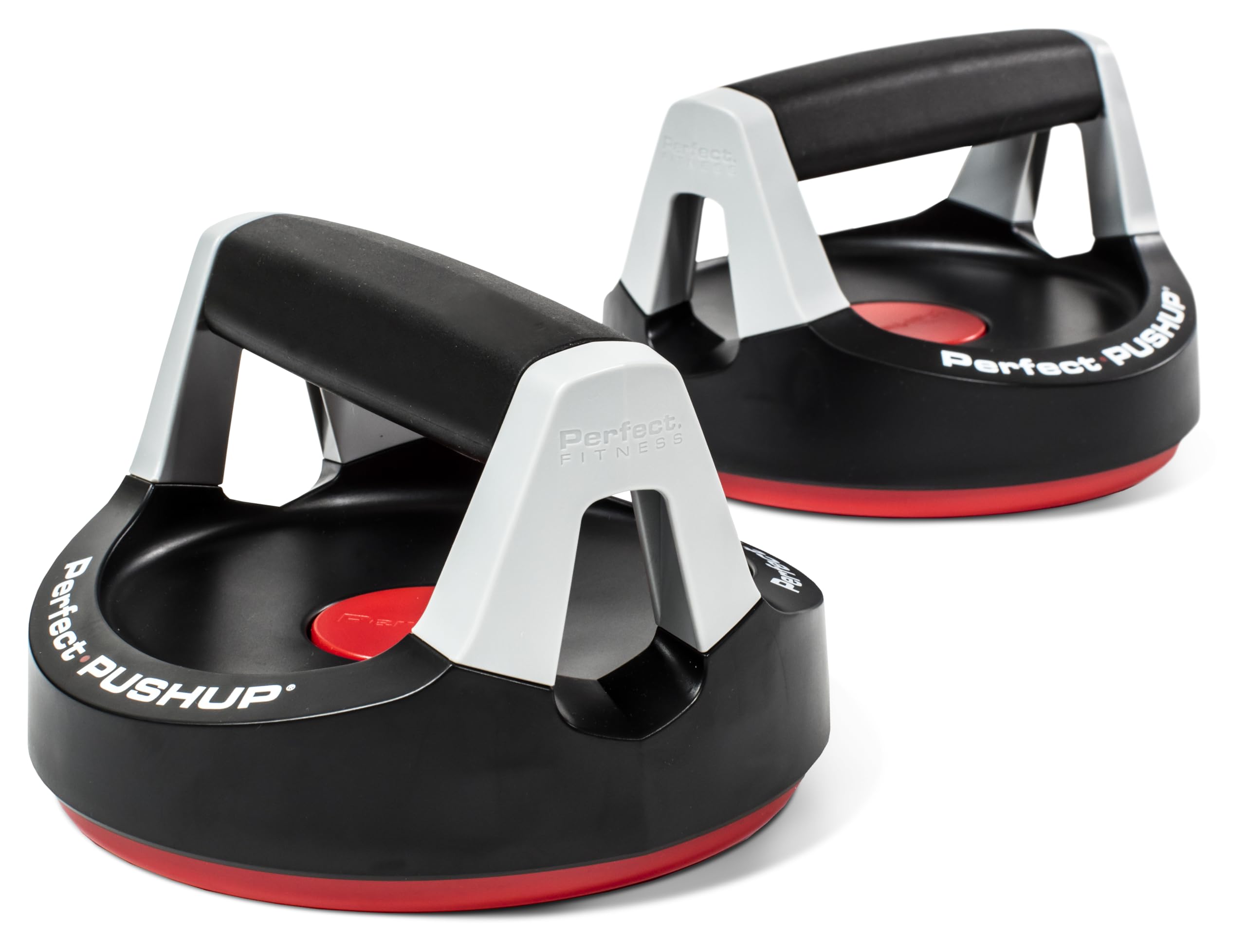 A pair of stable push-up handles on a hardwood floor with a yoga mat nearby, ready for a home workout