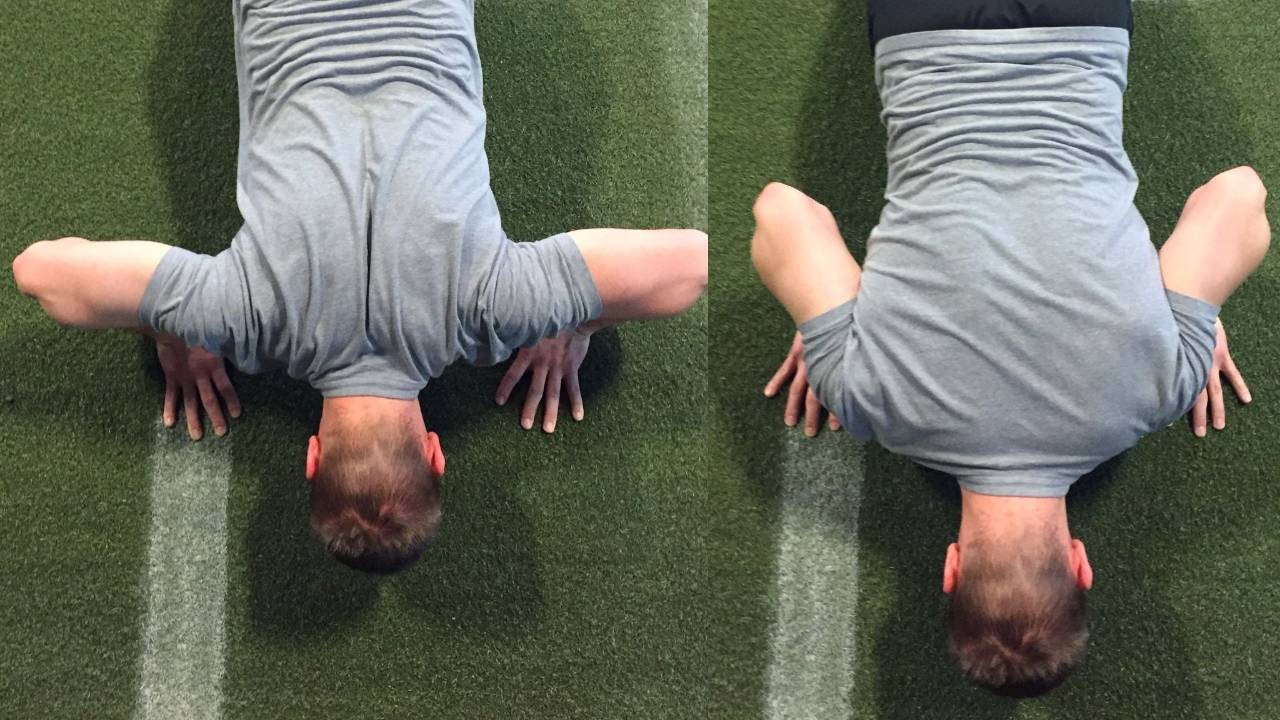Side view of a person lowering into a push-up with elbows angled about 45 degrees from the torso, body staying straight and braced